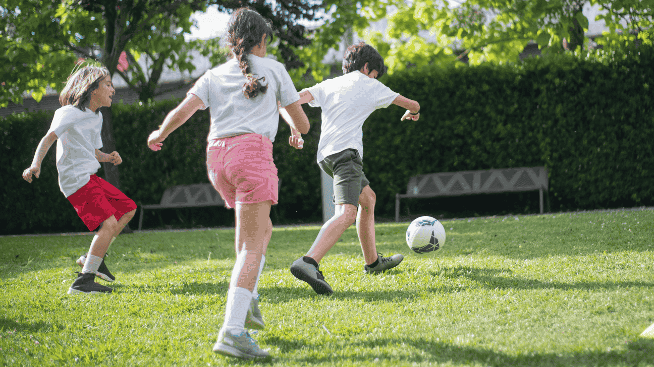 children playing football in ground